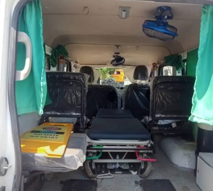 Ambulance side view with emergency signage