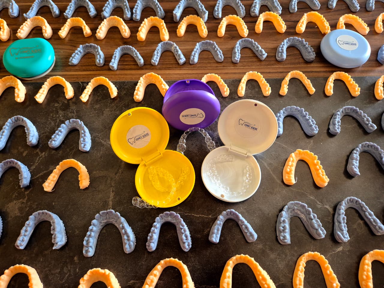 Thermoforming clear aligner material over a dental model